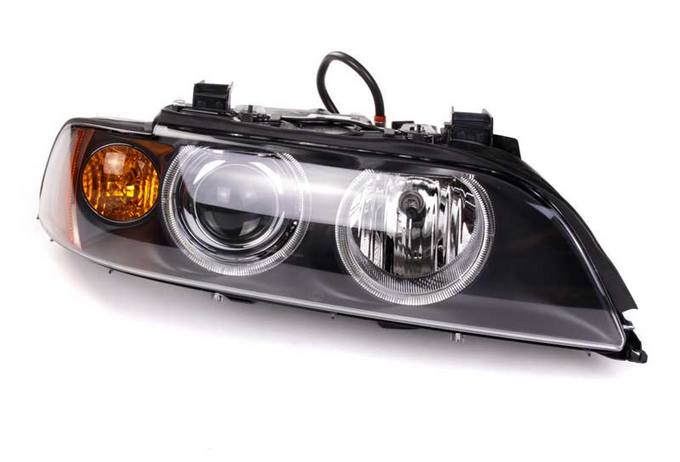 BMW Headlight Assembly – Passenger Side (Xenon) 63126912434 – Hella 008052901